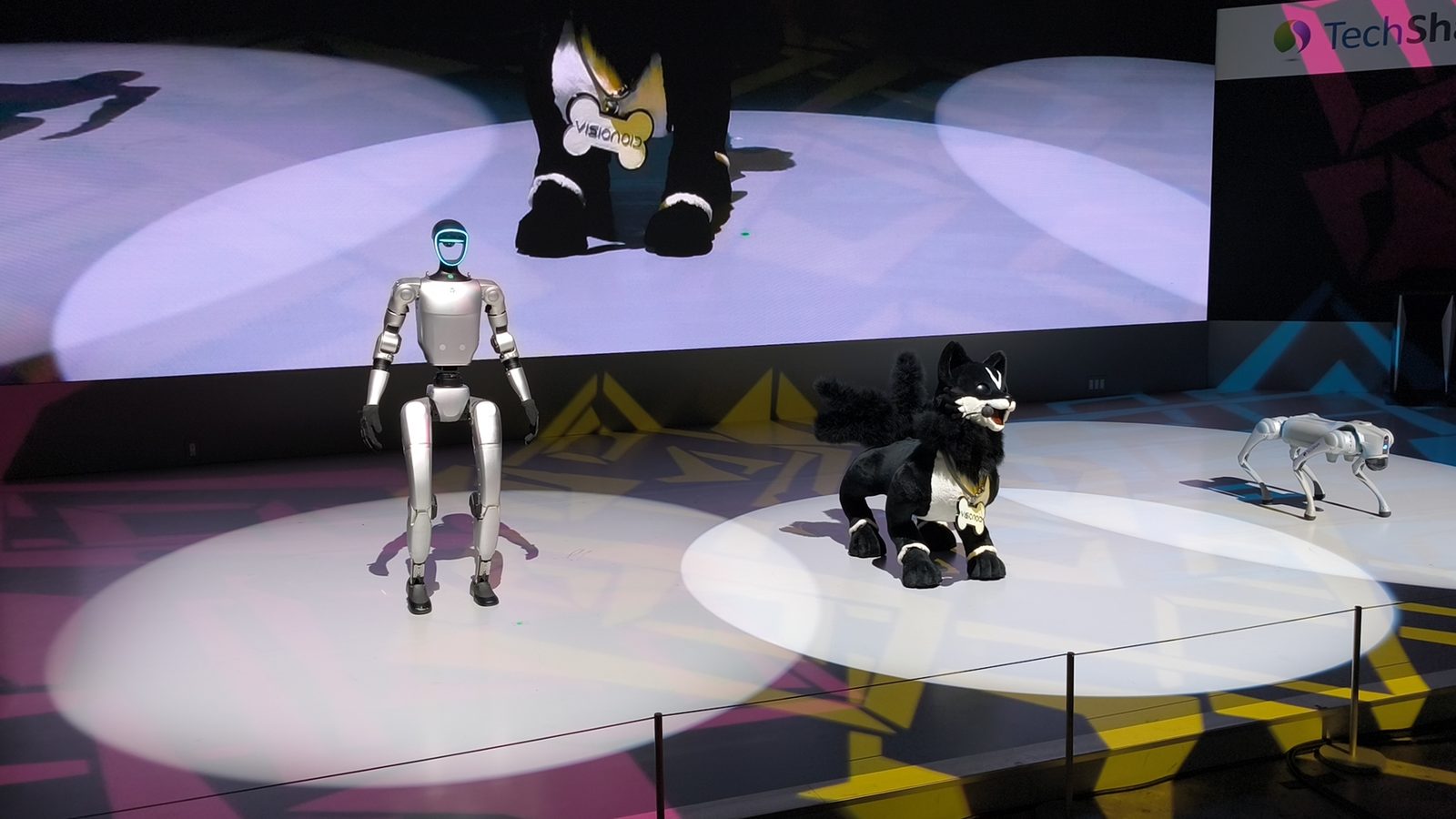 Humanoid and quadruped robots on stage at the Japan Mobility Show 2025