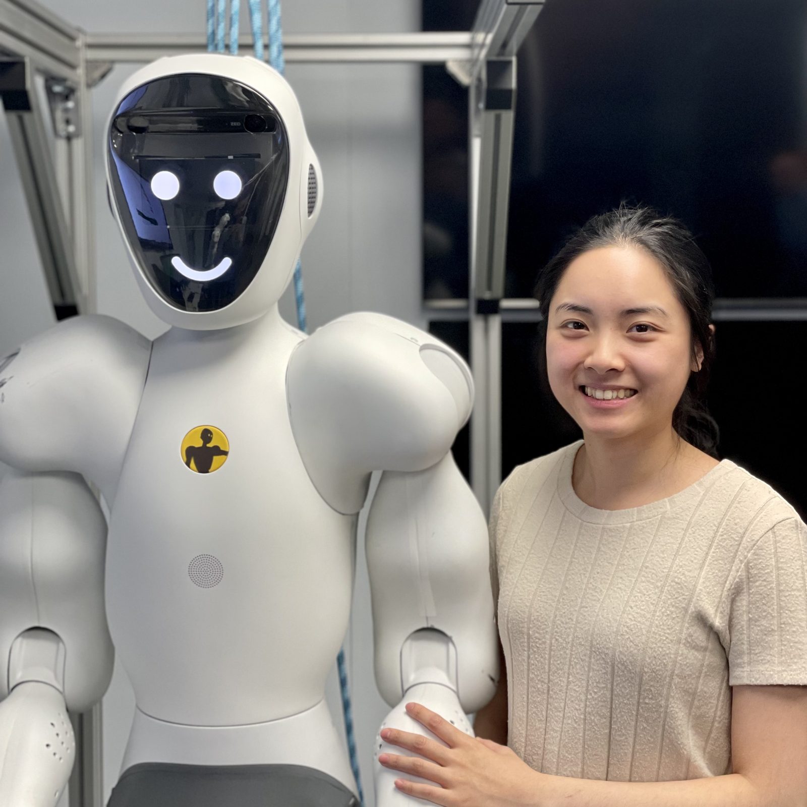 A Halodi Robotics engineer working alongside a humanoid collaborative robot