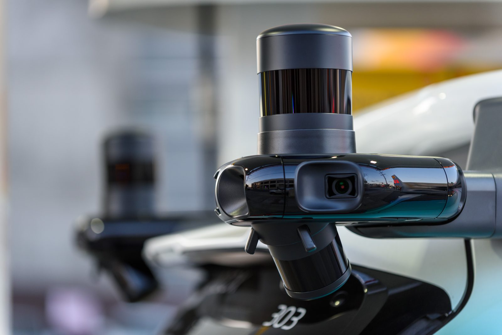 Close-up of a LiDAR and camera sensor pod on an autonomous test vehicle