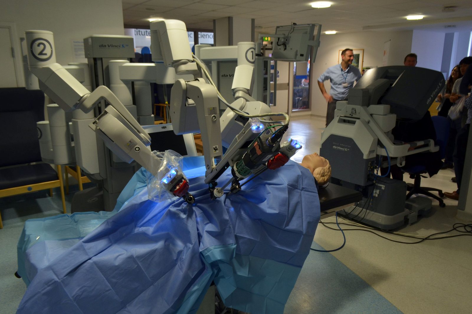 A da Vinci Surgical System on exhibit, showing the full unit with its patient-side arms